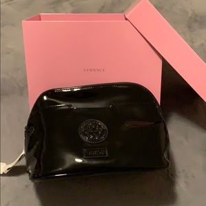 Versace black patent cosmetic bag.